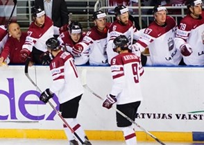 The Latvian players celebrate a goal in the 8-1 win against Austria. Photo: Jelena Levsina